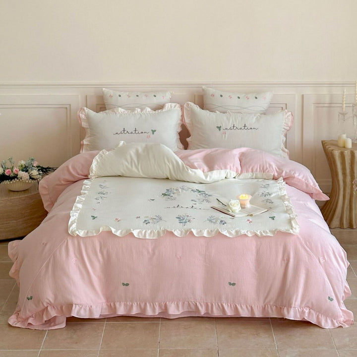 Bedding set with ruffles, embroidered middle cover and delicate flower application