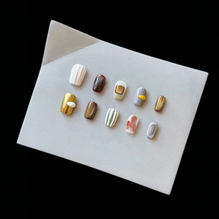 Artistic Press-On Nail Set with Unique Textured Designs