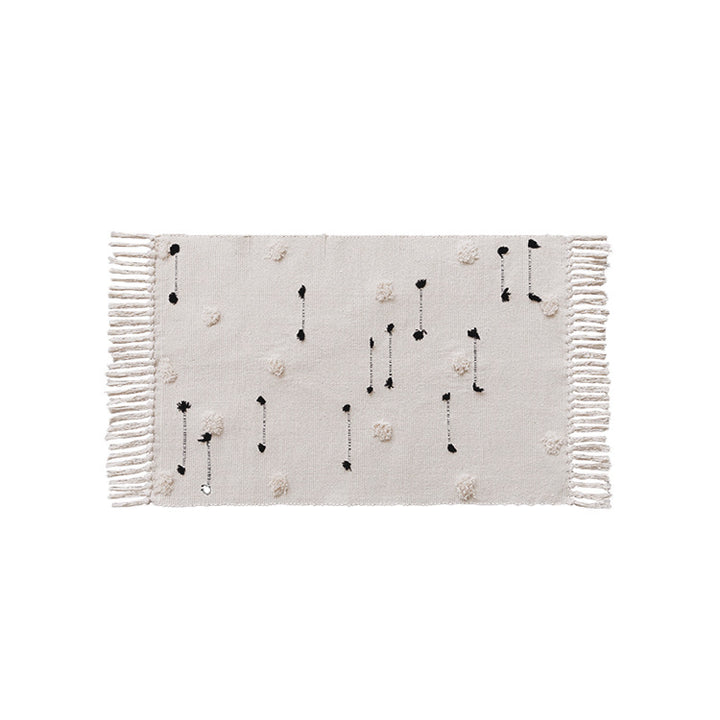Handwoven cotton runner with pompom tufting and decorative fringes