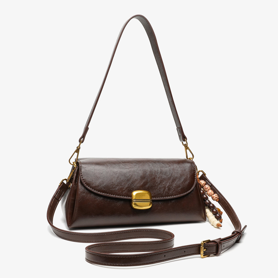 Elegant Handheld Shoulder Bag with Decorative Beaded Charm