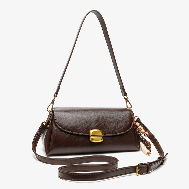 Elegant Handheld Shoulder Bag with Decorative Beaded Charm