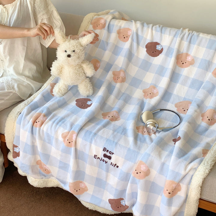 Reversible fleece blanket with cartoon cat design and teddy lining