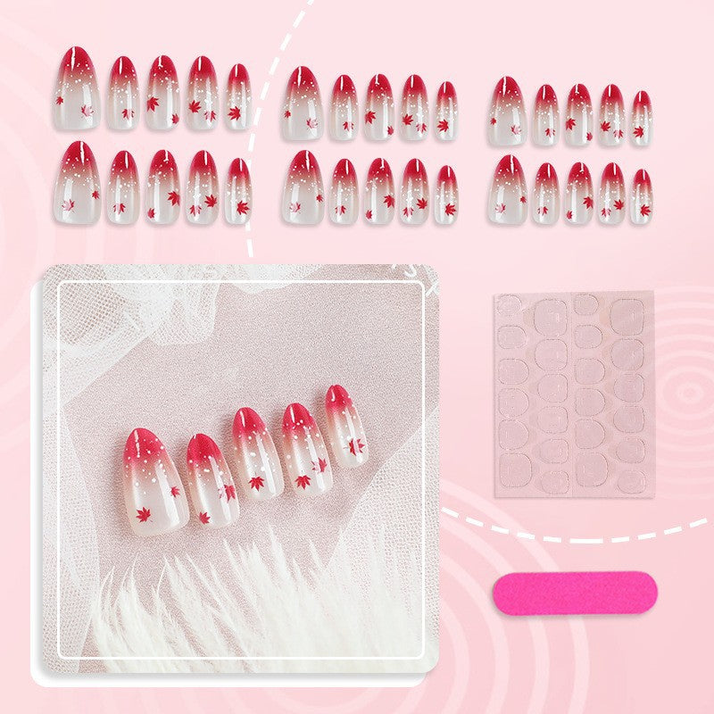Art nail set with elegant red ombré look and delicate maple leaves Kalsten