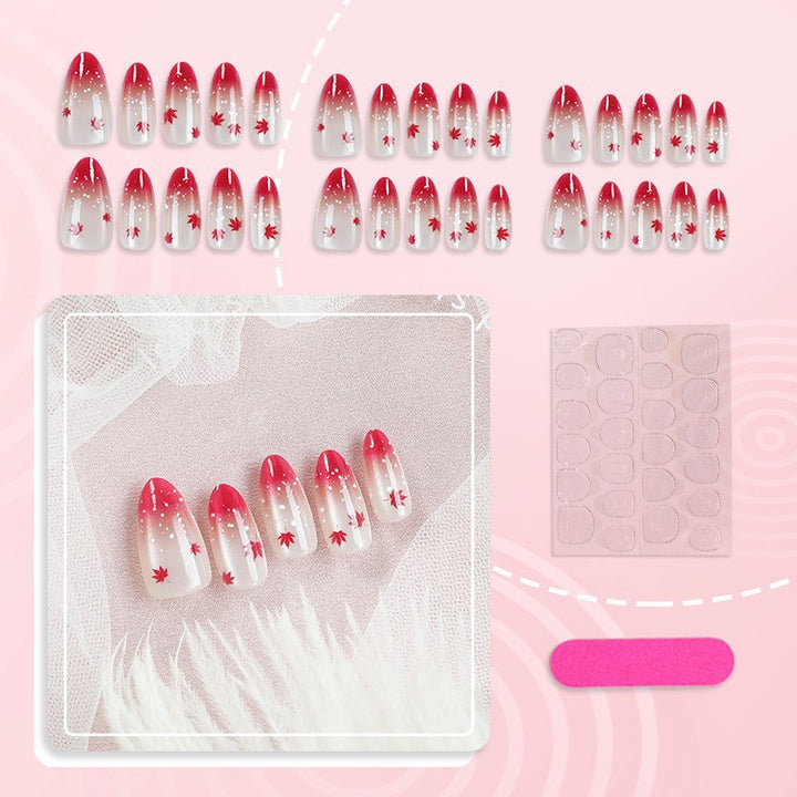 Art nail set with elegant red ombré look and delicate maple leaves Kalsten