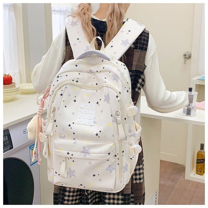 Playful backpack with star motifs and practical functions Kalsten