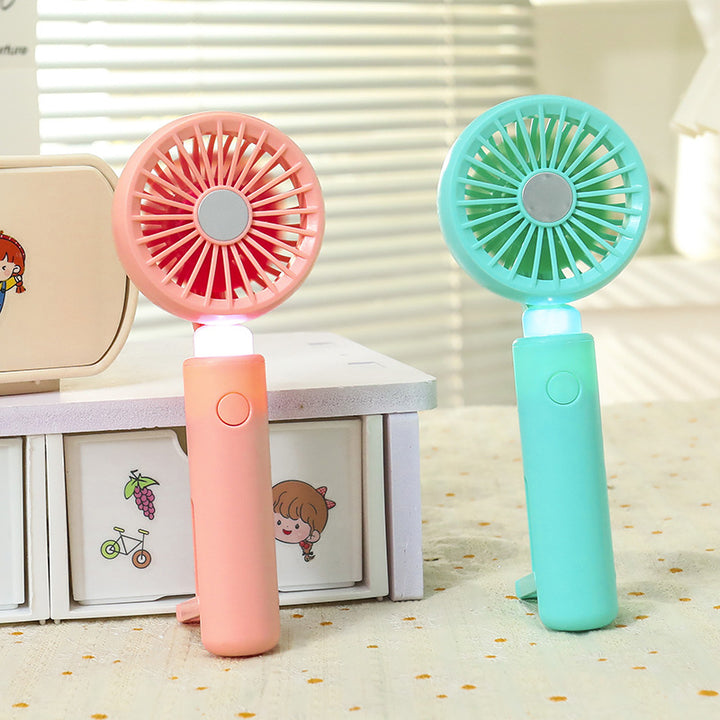 Women portable mini hand fan with integrated LED lighting and USB charging function Kalsten