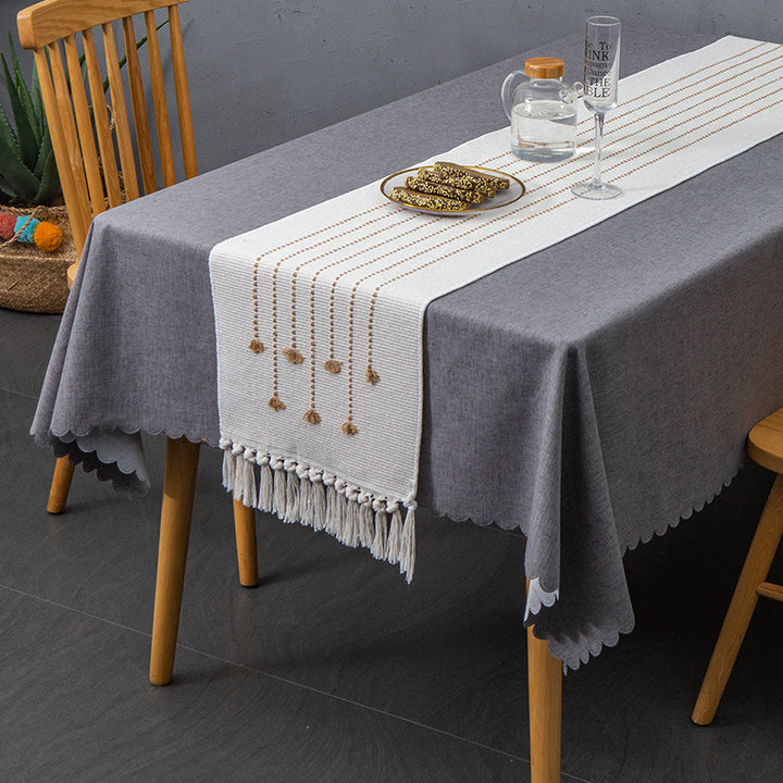 Decorative table runner in Scandinavian-minimalist design with macrame fringes Kalsten