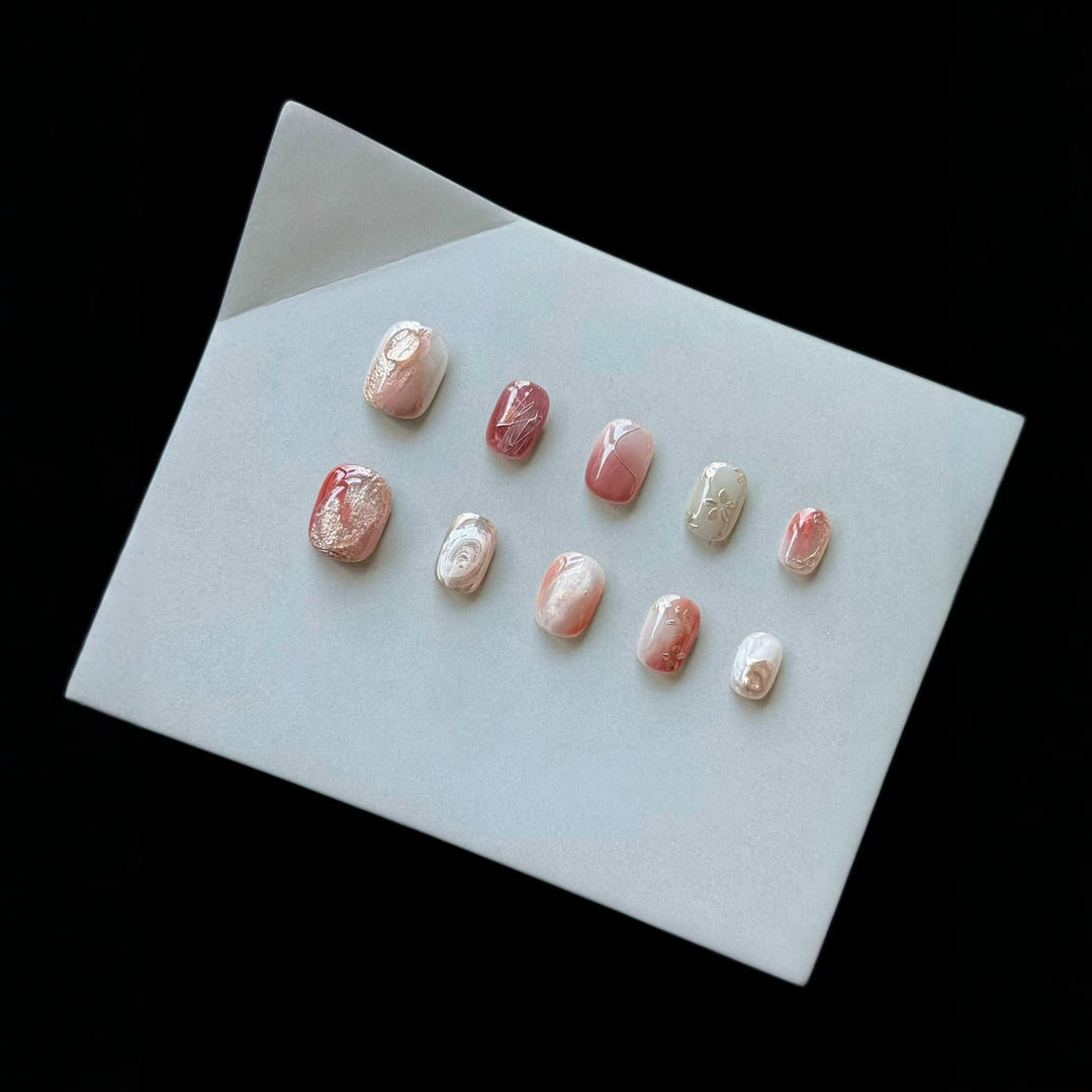 Artistic Press-On Nail Set with Marble and Metallic Accents