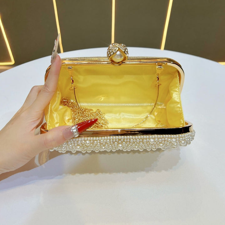 Decorative Pearl Clutch with Gold Accents