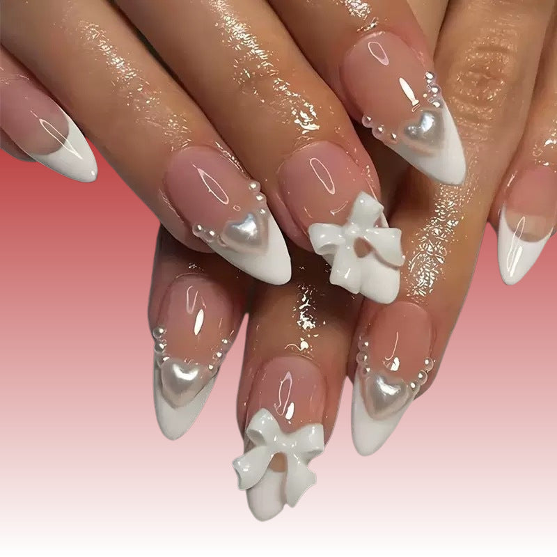 Elegant artificial nails with curved tips and decorative bows Kalsten