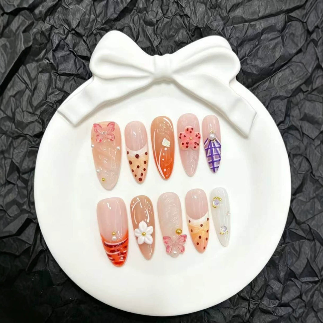 Artistic Press-On Nails Set with Floral and Decorative Accents