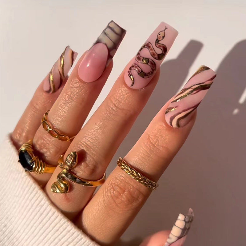 Artful Nail Art with Snake Design and Metallic Elements Kalsten