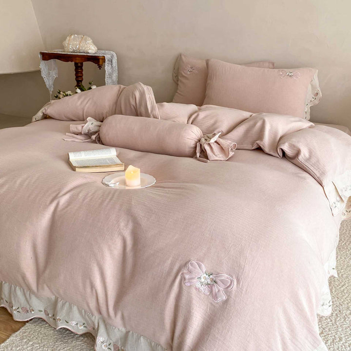 Bedding set made of linen-cotton blend with hand-stitched bow appliqués and gathered ruffle