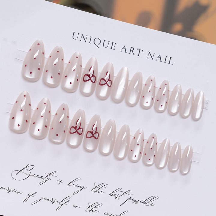 Elegant Stiletto Press-On Nail Art with Minimalist Bow Design