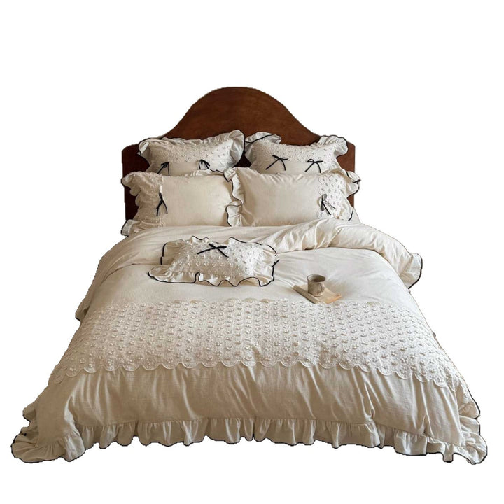Romantic cotton-linen bed linen set with broderie anglaise, frills, and contrast piping