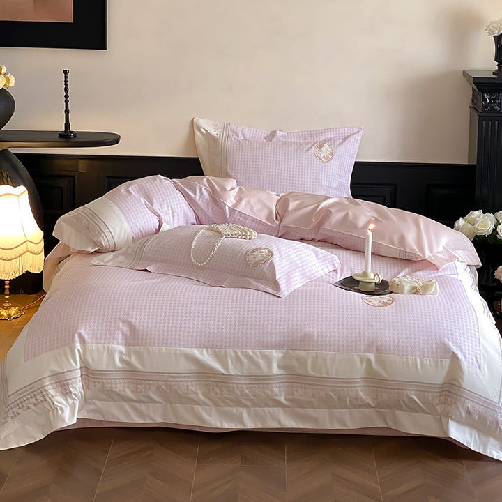 Luxurious cotton satin bedding set with embroidered medallion applications and fine edging