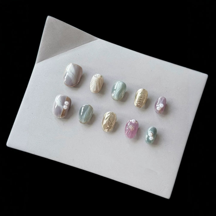 Artistic Press-On Nail Set with Natural Marble Designs
