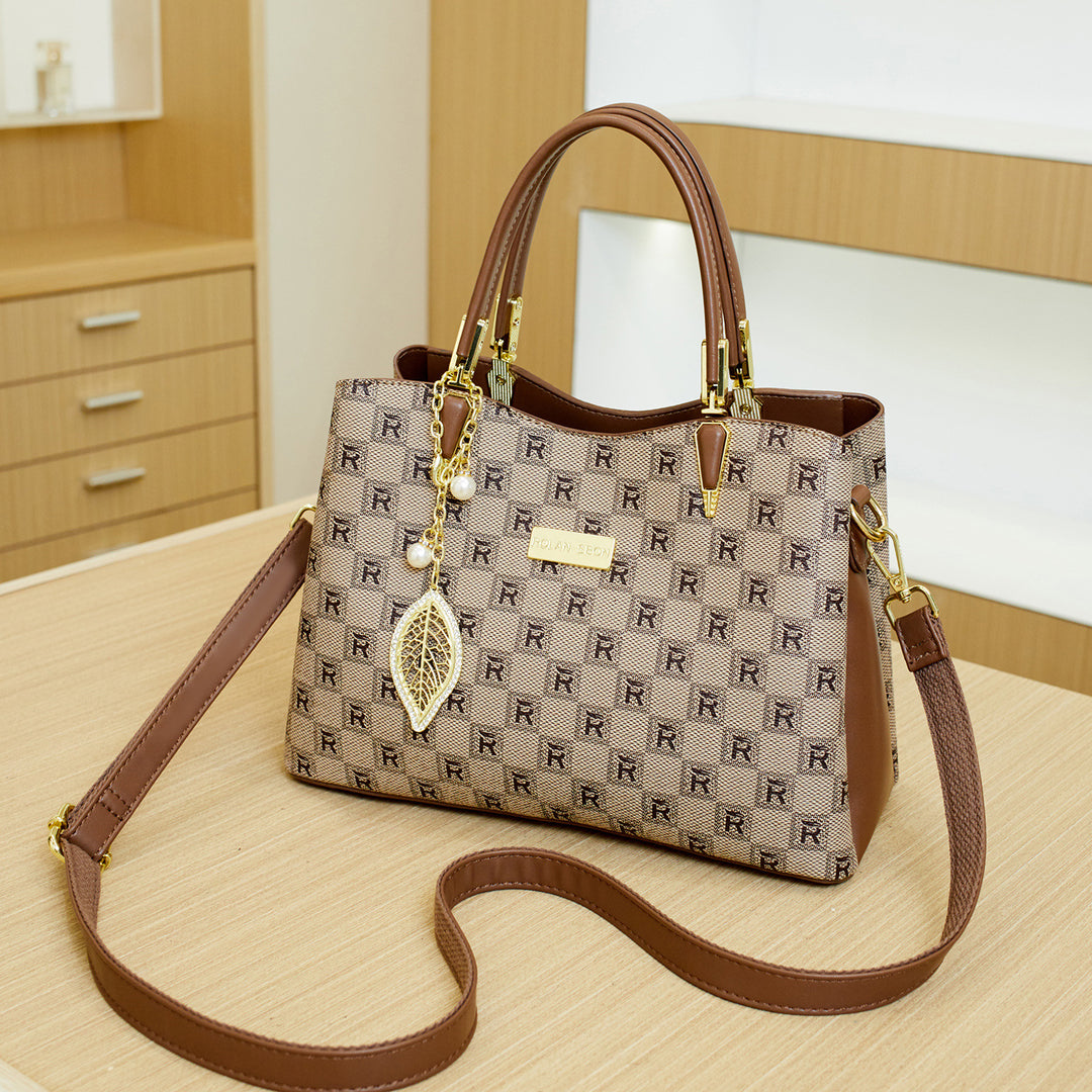 Elegant Designer Handbag with Decorative Charm