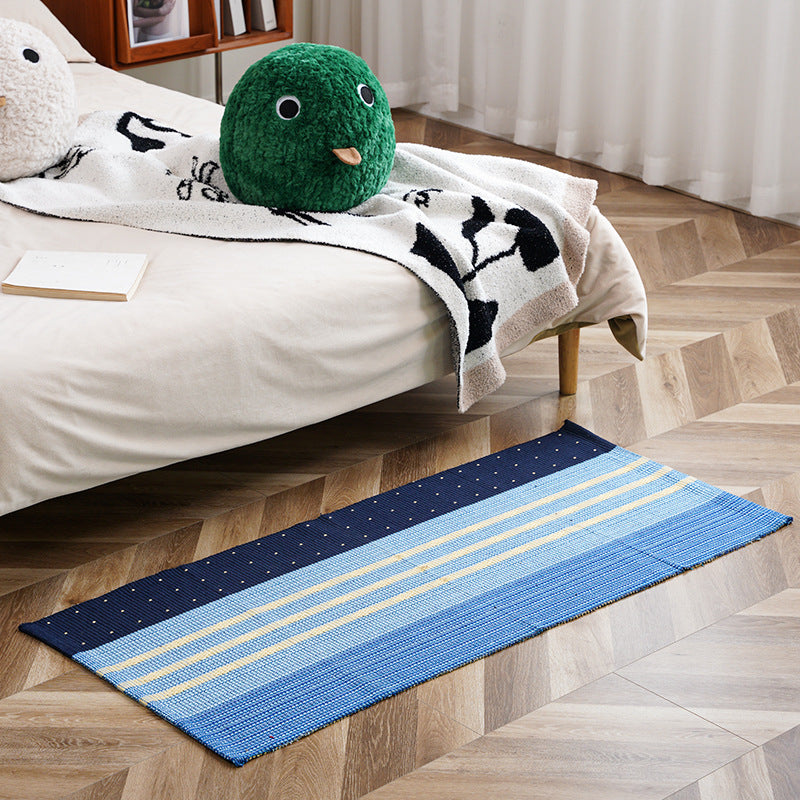 woven living room runner with fringes and geometric weave pattern