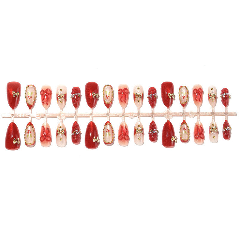 Acrylic nail set with festive designs and glitter elements Kalsten