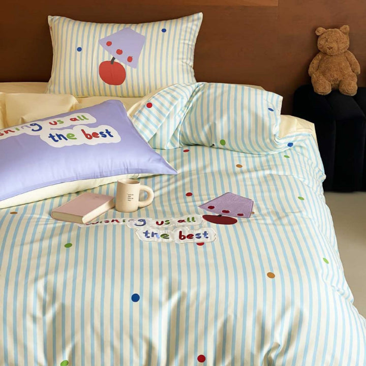 Children's bedding set made of cotton percale with striped design, appliquéd lettering, and playful dot appliqués