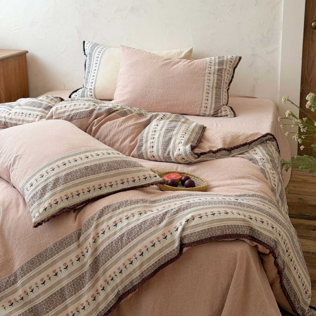 Country house style bedding set with striped floral border and fringes