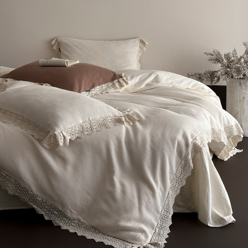 Bedding set with crocheted lace trim and linen look