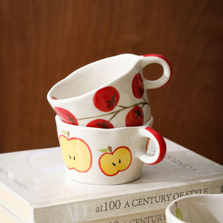 Ceramic mug with hand-painted banana illustration and round handle