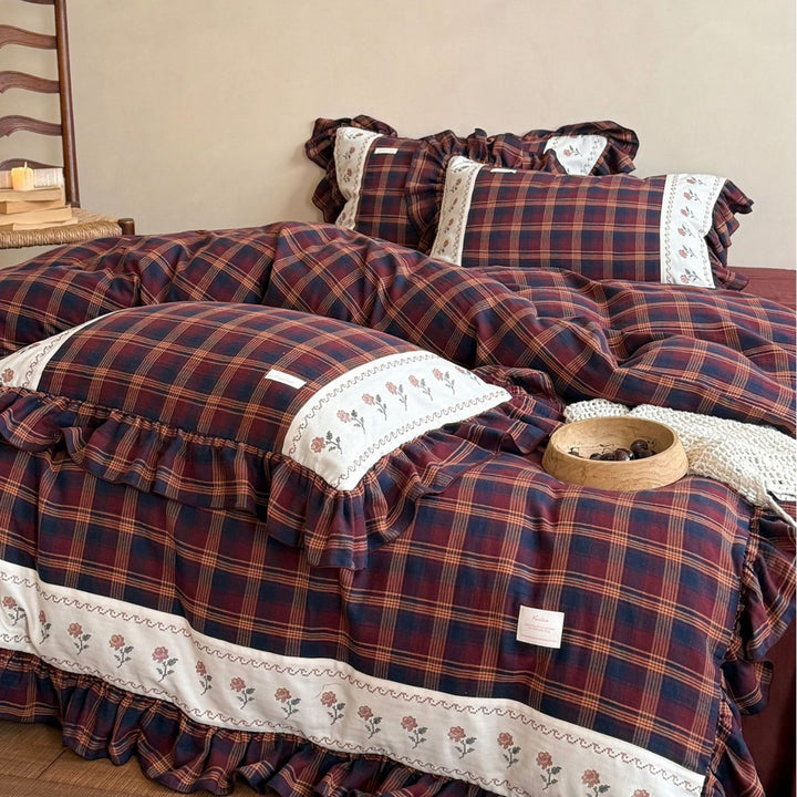 Checked bedding set in vintage cottage style with ruffle and embroidered border