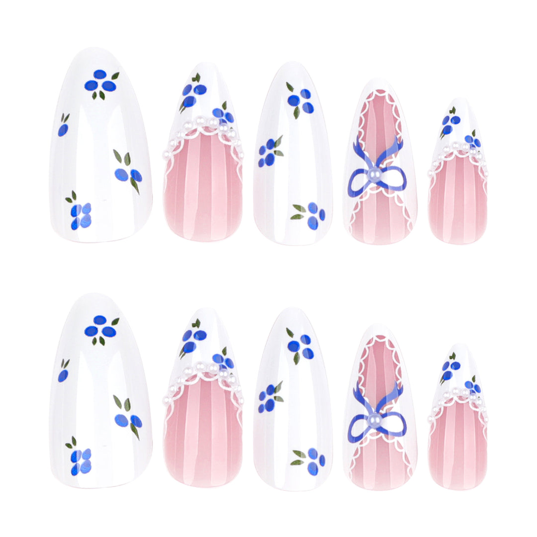 Artful nail art with floral accents and bow embellishment Kalsten