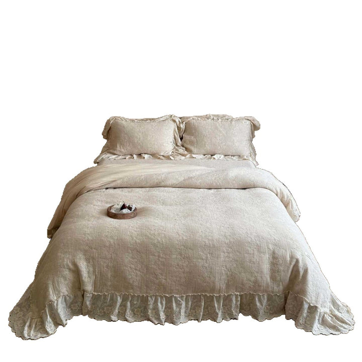 Vintage-inspired ruffled bedding set made of cotton muslin with fine floral embroidery