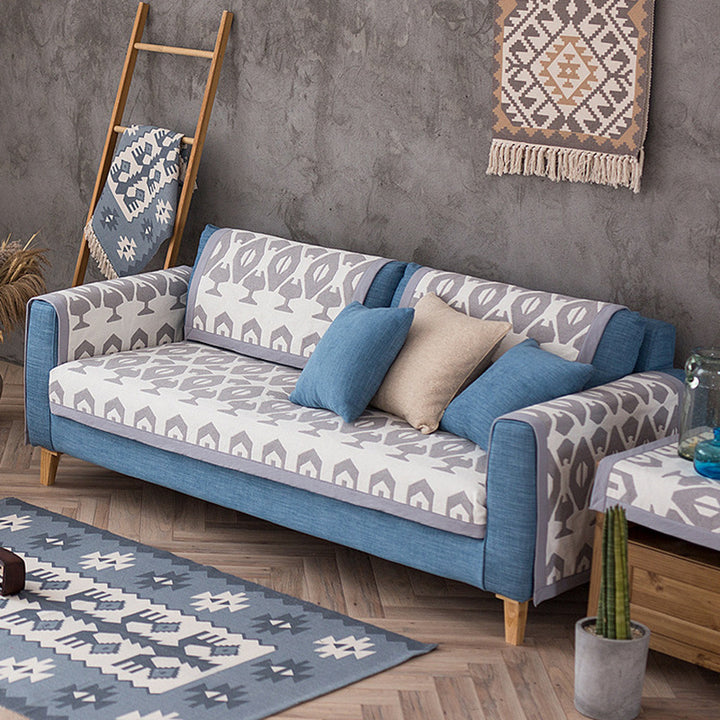 Universal sofa protective cover for three-seater with leaf print, non-slip underside and separate armrest covers Kalsten