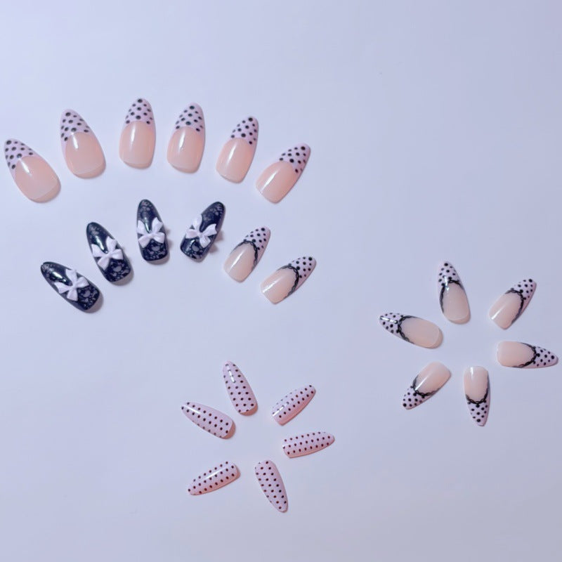 Elegant artificial nails with lace design and bow accents Kalsten