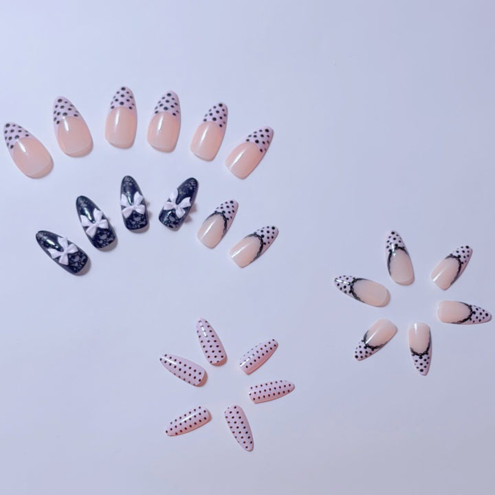 Elegant artificial nails with lace design and bow accents Kalsten