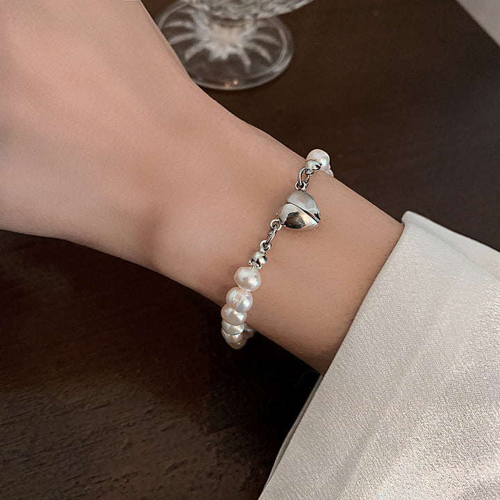Elegant silver pearl bracelet with heart details Kalsten