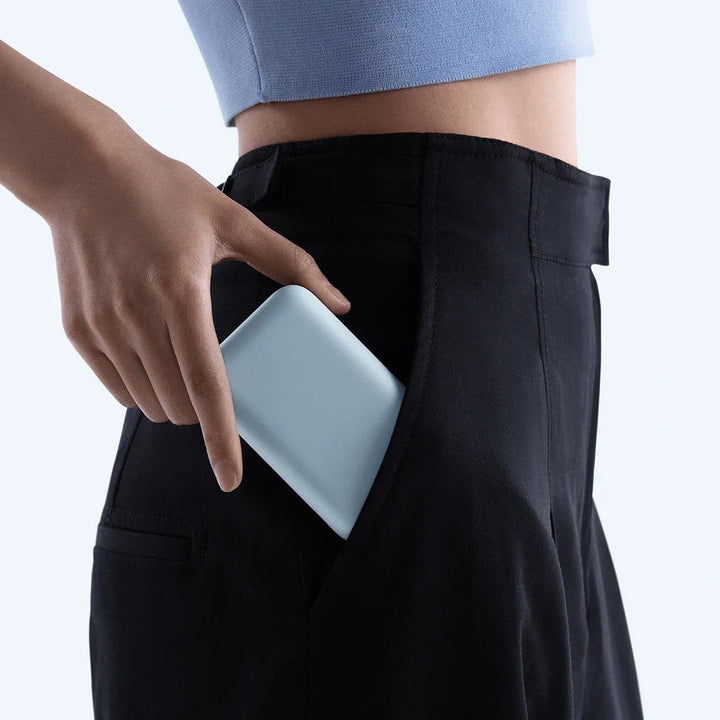 Compact High-capacity portable power bank with integrated USB-C cable and silicone carry loop Kalsten