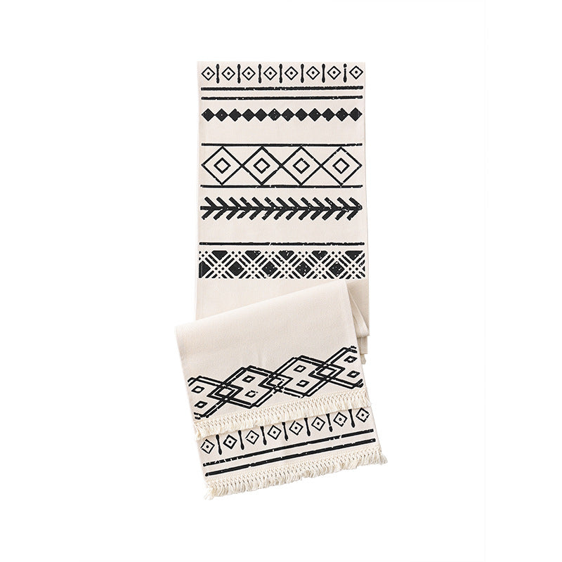 decorative table runner with geometric ethnic pattern and fringe