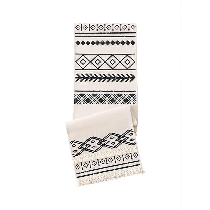 decorative table runner with geometric ethnic pattern and fringe