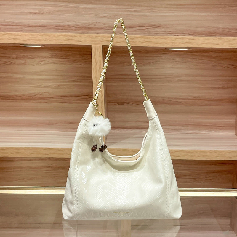 Chic Shoulder Bag with Decorative Charm