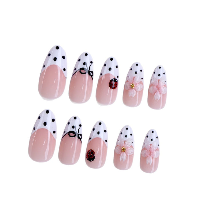 Artificial nail art with floral and playful accents Kalsten