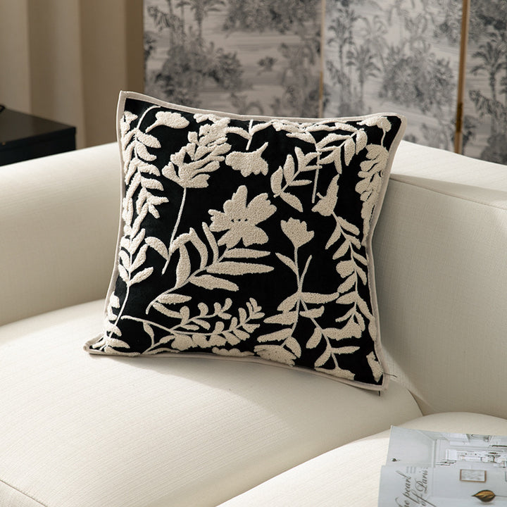 Square decorative pillow with floral flock embroidery and fine piping edge