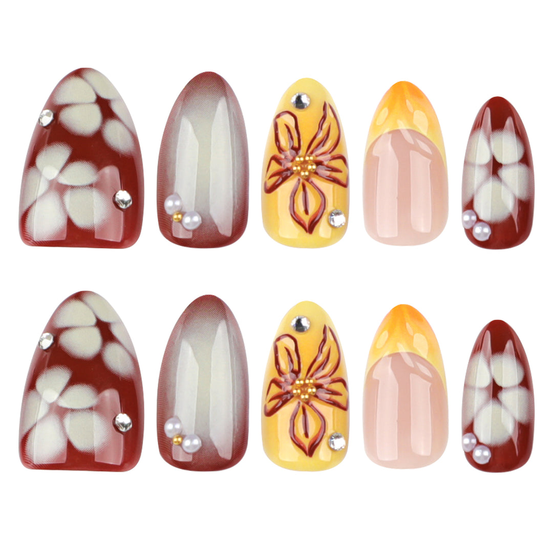 Artificial nail extensions with floral design and rhinestone embellishments Kalsten