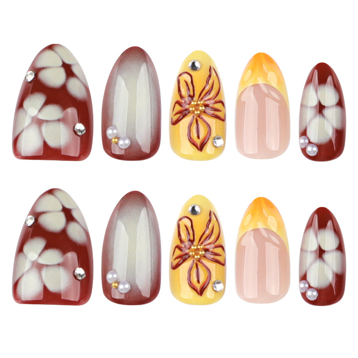 Artificial nail extensions with floral design and rhinestone embellishments Kalsten