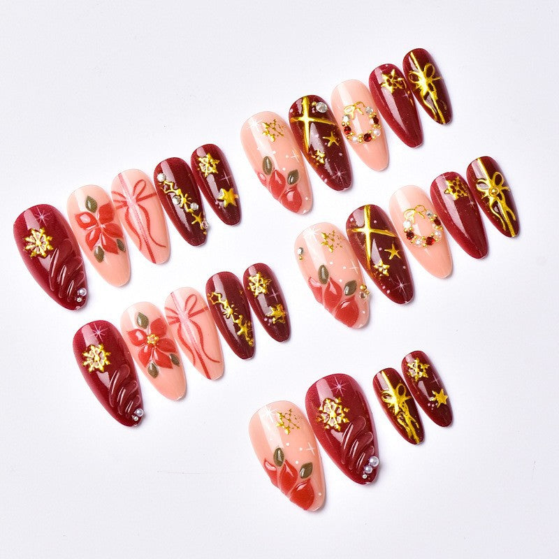 Artificial nail set with luxurious Christmas designs and glamorous accents Kalsten