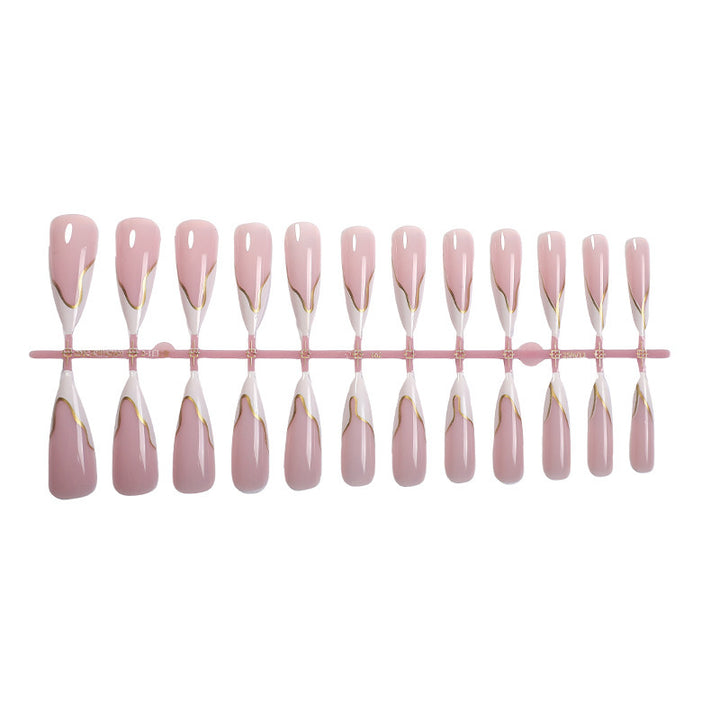 Artifical nail set with elegant gold trim and delicate pink Kalsten