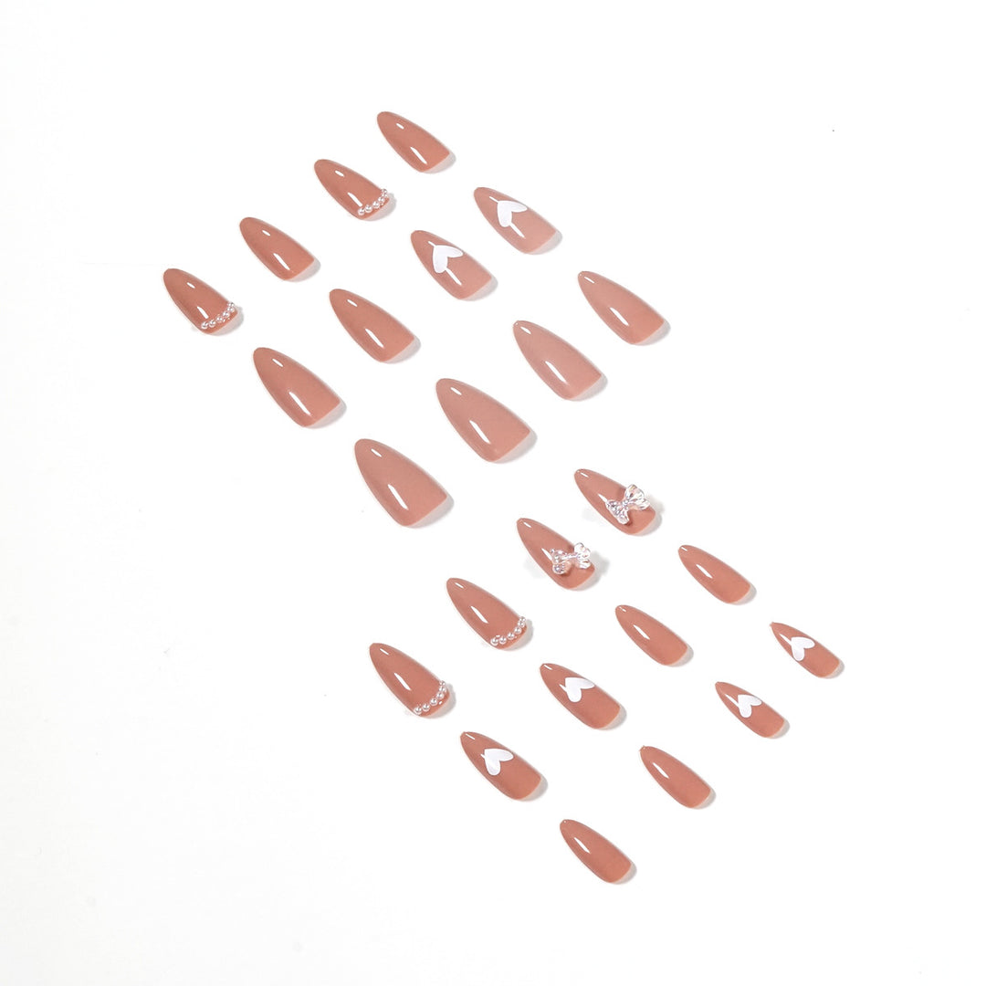 Elegant artificial nails with heart-shaped and glitter accents Kalsten
