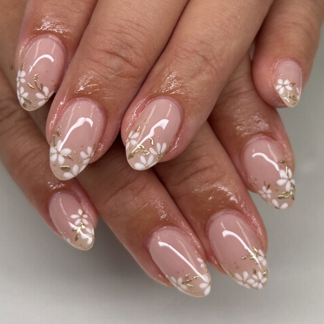 Artful nail art with floral design and glitter accents Kalsten