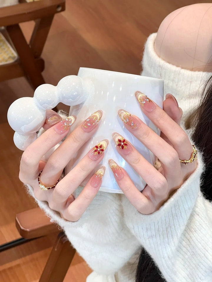 Artificial nails with elegant flower design and glitter accents Kalsten
