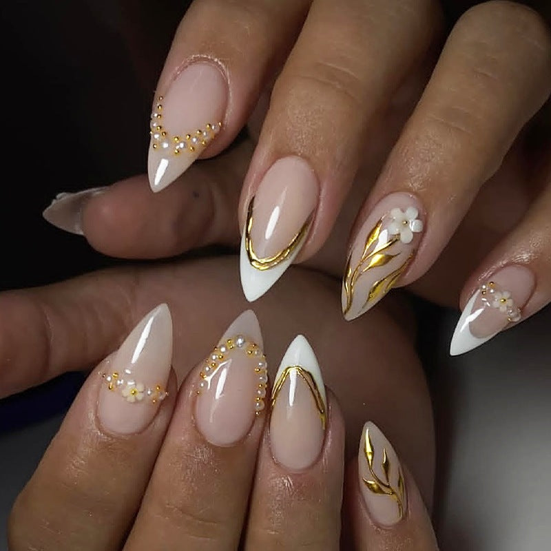 Artificial nail set with elegant gold accents and floral designs Kalsten