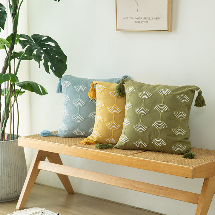 Square decorative pillow with embroidered fan motif and decorative tassels